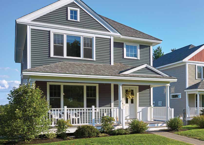 Gray two-story home with white trim and a covered front porch, finished in CertainTeed MainStreet Double 4-inch Clapboard siding in Flagstone