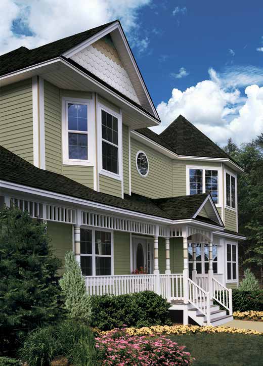Green Victorian-style home sided in CertainTeed MainStreet Double 4-inch Clapboard in Cypress, one of the available MainStreet colors